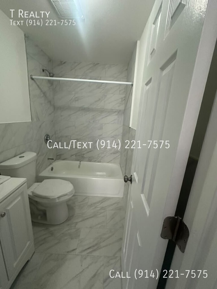 128 W 3rd St - Photo 3 of 4