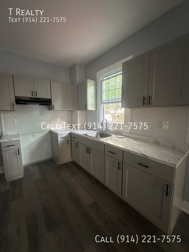 128 W 3rd St - Photo 4 of 4