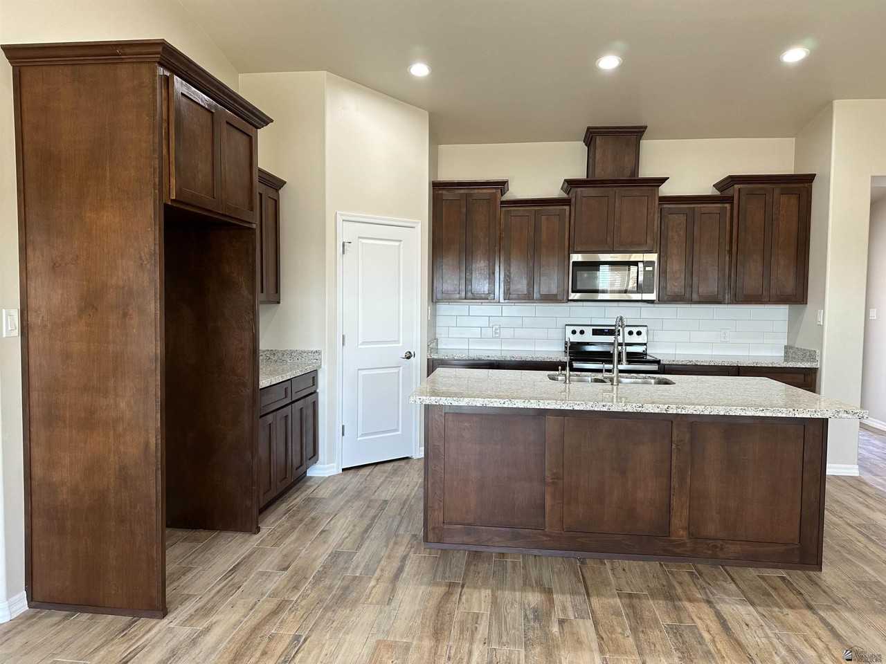 12623 E 50th Ln - Photo 3 of 15