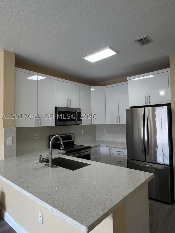 7080 Nw 177th St #203-13 - Photo 4 of 26