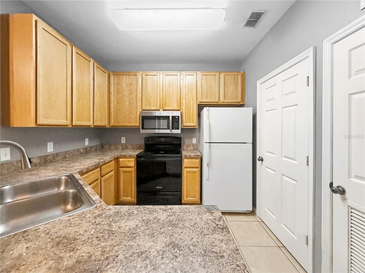 10209 Courtney Palms Blvd #203 - Photo 4 of 25