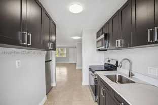 850 E Commercial Blvd #214B - Photo 1 of 1