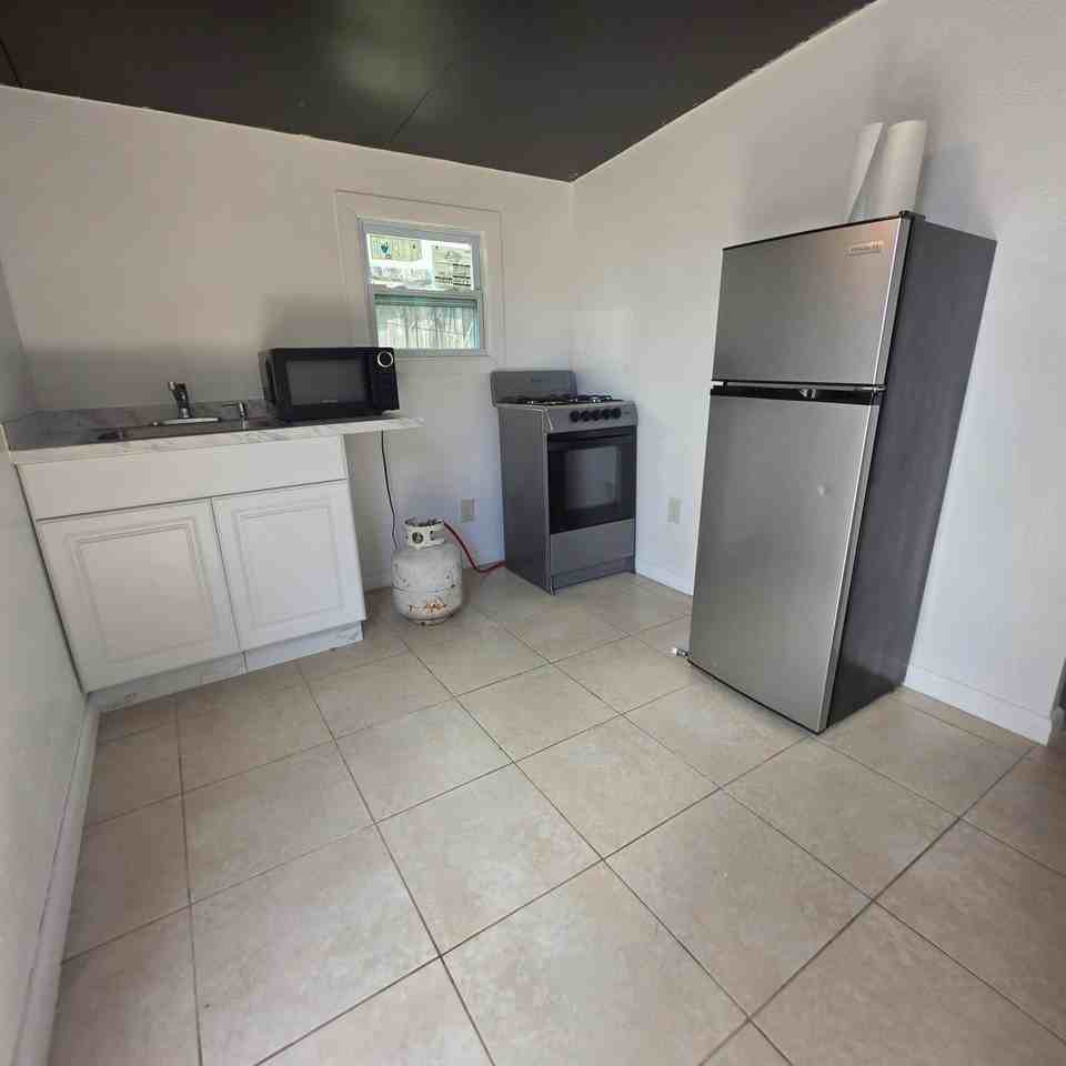 7400 Raleigh St - Photo 2 of 4