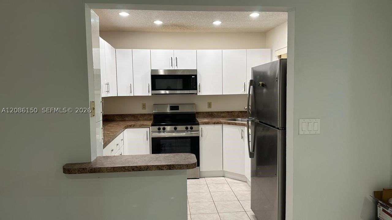 3679 Cocoplum Cir #3528 - Photo 7 of 31