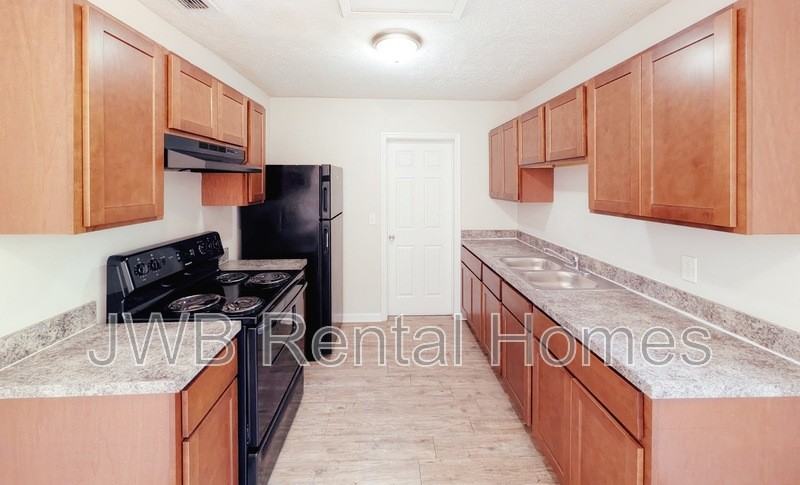 7137 Eudine Dr N - Photo 2 of 17