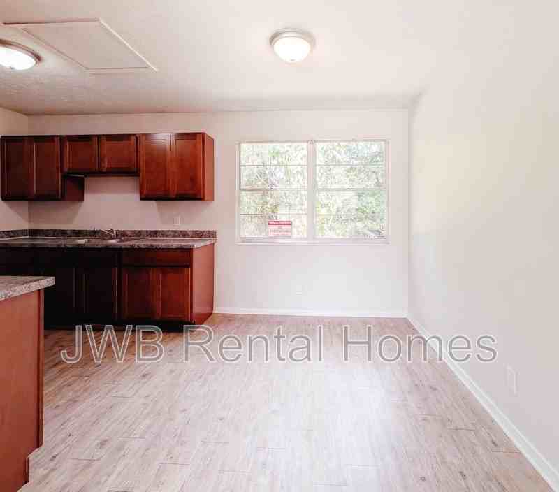 7137 Eudine Dr N - Photo 4 of 17