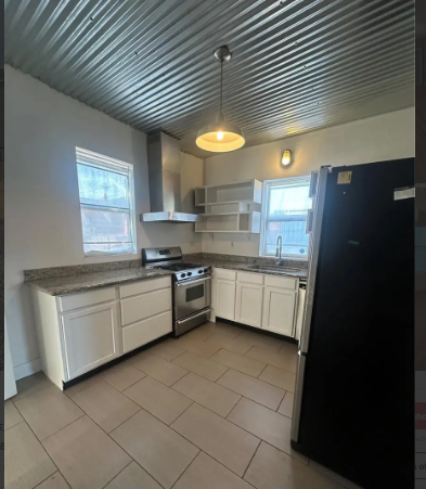 418 W 43rd Ave - Photo 6 of 9