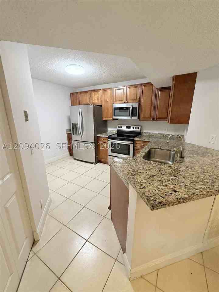 8741 Wiles Rd #204 - Photo 2 of 11