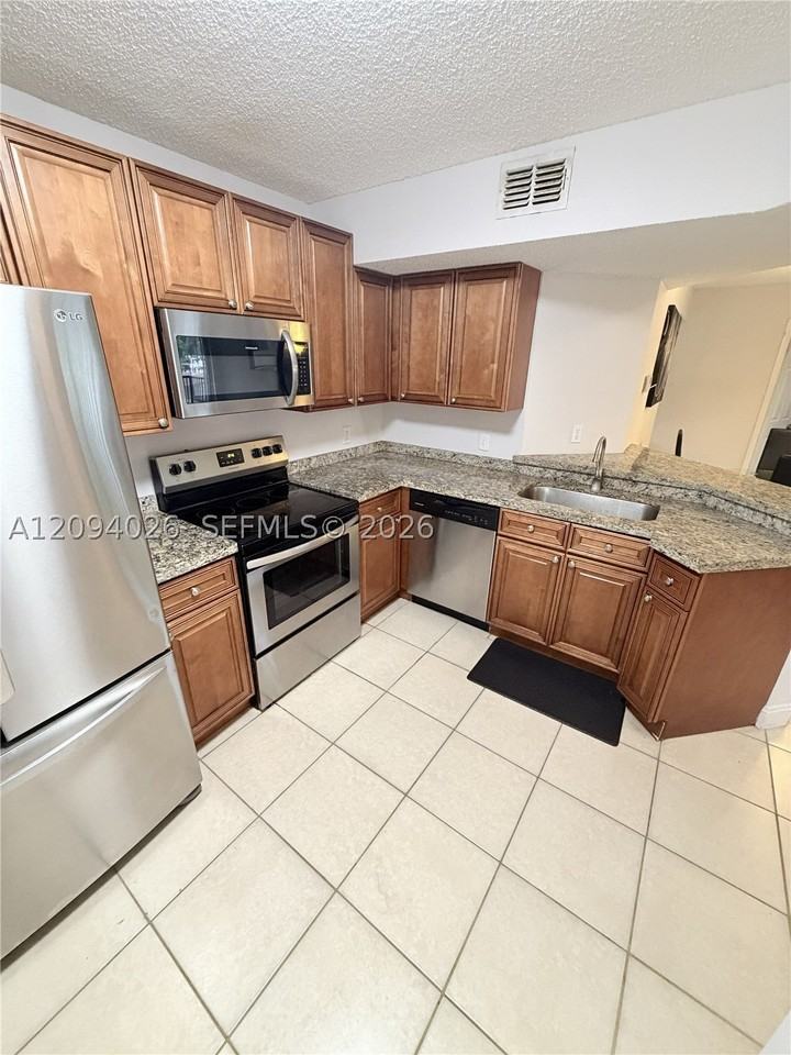 8741 Wiles Rd #204 - Photo 3 of 11