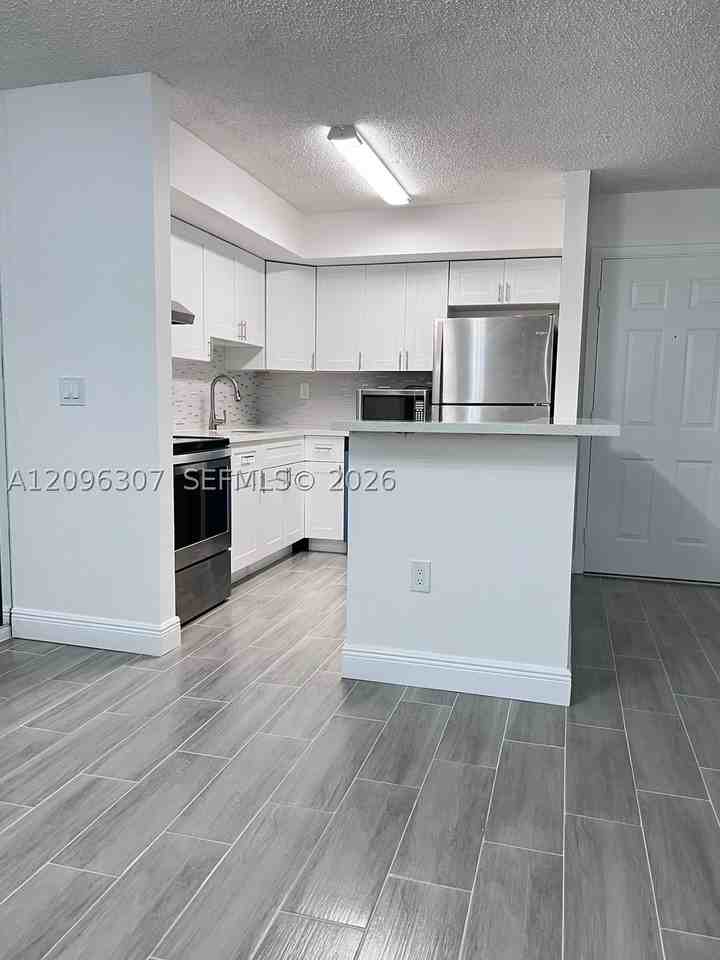 19055 Nw 62nd Ave #111 - Photo 3 of 26