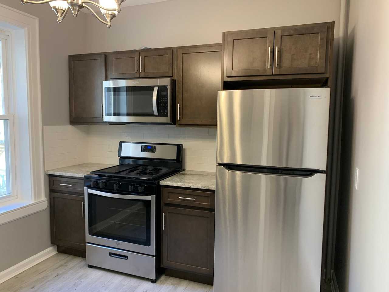 Full Renovations, SS appliances, New Bath, HW Floors - Photo 3 of 5