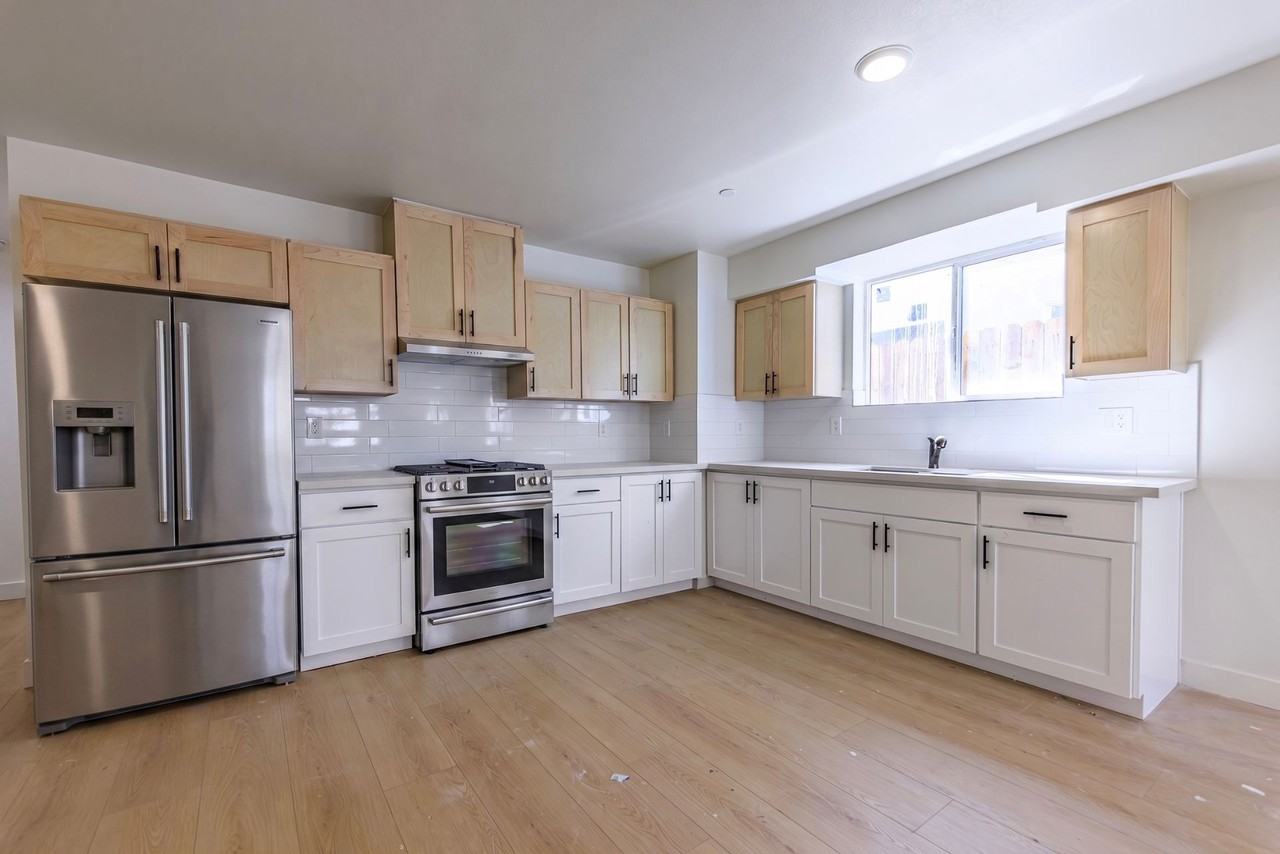 Modern 2026 Townhomes with Massive Bedrooms + Central Air + Brand NEW Appliances + Laundry IN UNIT! - Photo 3 of 7