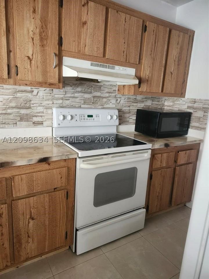 10037 Winding Lake Rd #102 - Photo 3 of 9