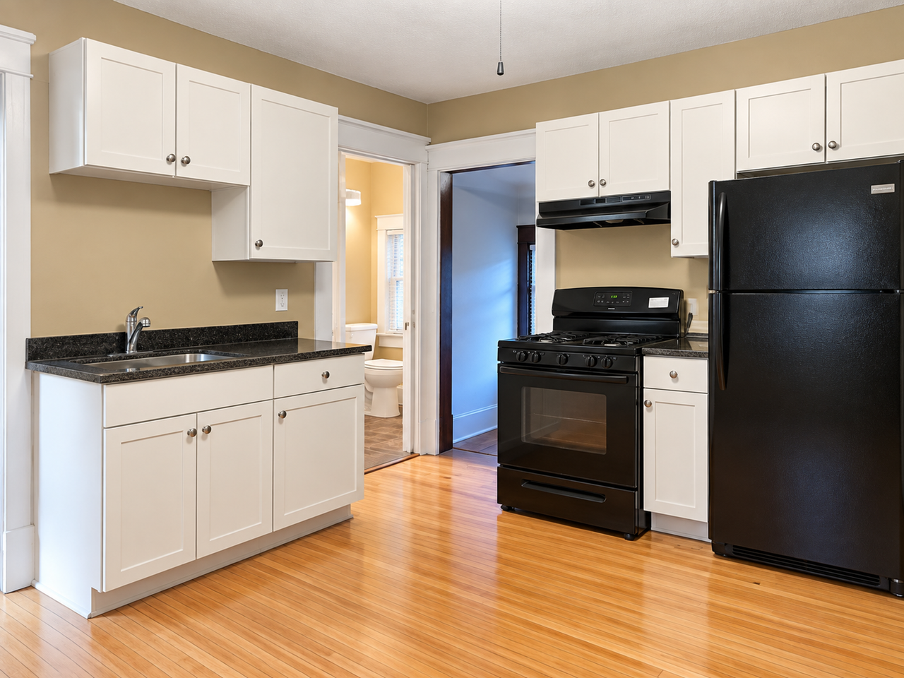 Charming Duplex Near West 7th – Hardwood Floors, Porch & Garage! - Photo 3 of 16