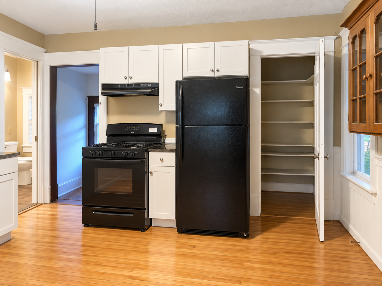 Charming Duplex Near West 7th – Hardwood Floors, Porch & Garage! - Photo 4 of 16