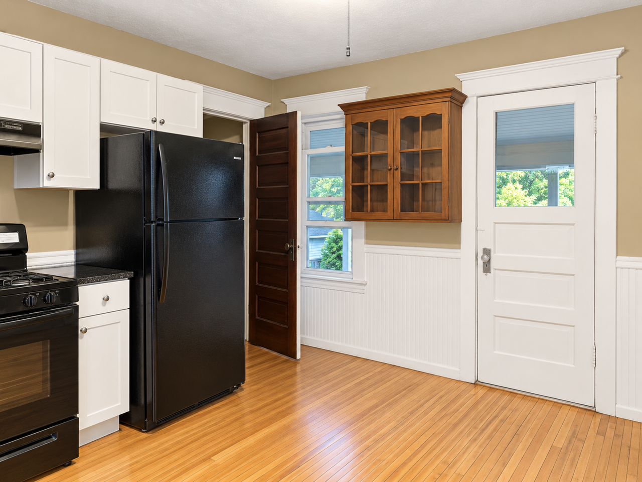 Charming Duplex Near West 7th – Hardwood Floors, Porch & Garage! - Photo 5 of 16