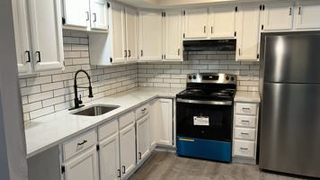 featured image of 115 E 5th St