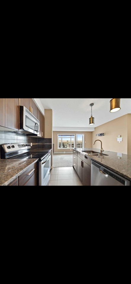 23 Millrise Drive Southwest #302 - Photo 2 of 12
