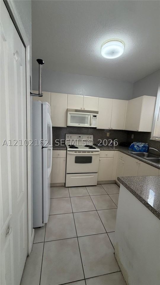 7030 Nw 177th St #A104 - Photo 4 of 10