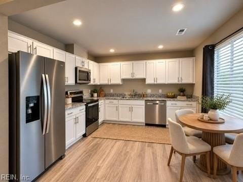 1102 Clarys Dr - Photo 4 of 15