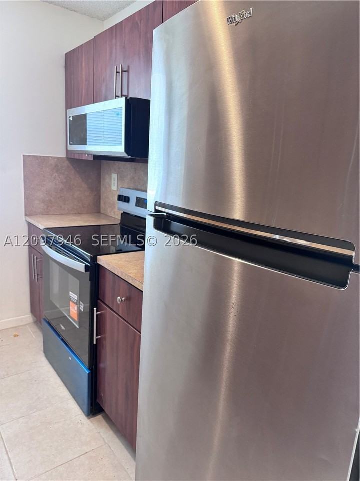 7070 Nw 179th St #105 - Photo 2 of 8