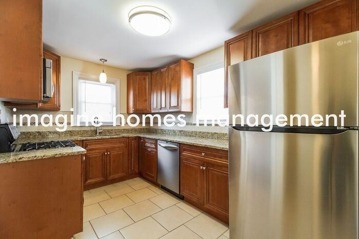 8315 Saint Clair Ave - Photo 6 of 16