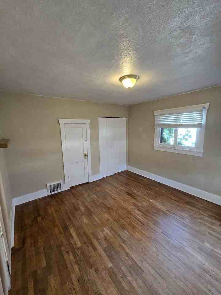 1107 S Ogden St - Photo 3 of 13