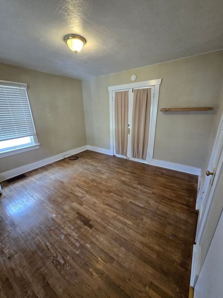 1107 S Ogden St - Photo 4 of 13
