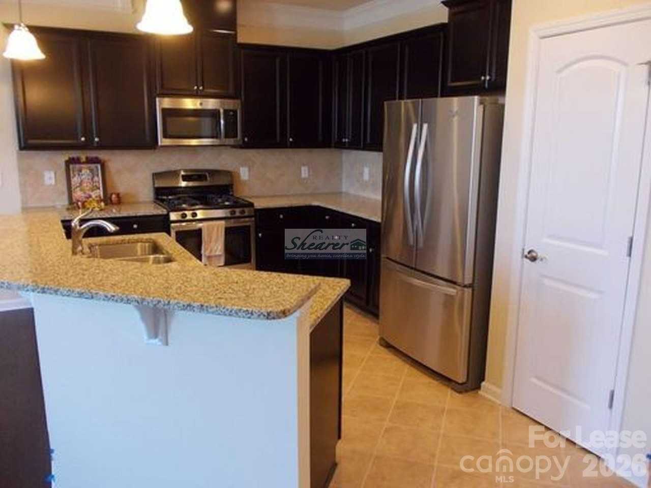 9597 Camberley Ave Nw - Photo 4 of 15