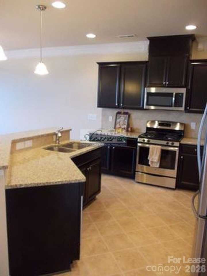 9597 Camberley Ave Nw - Photo 5 of 15