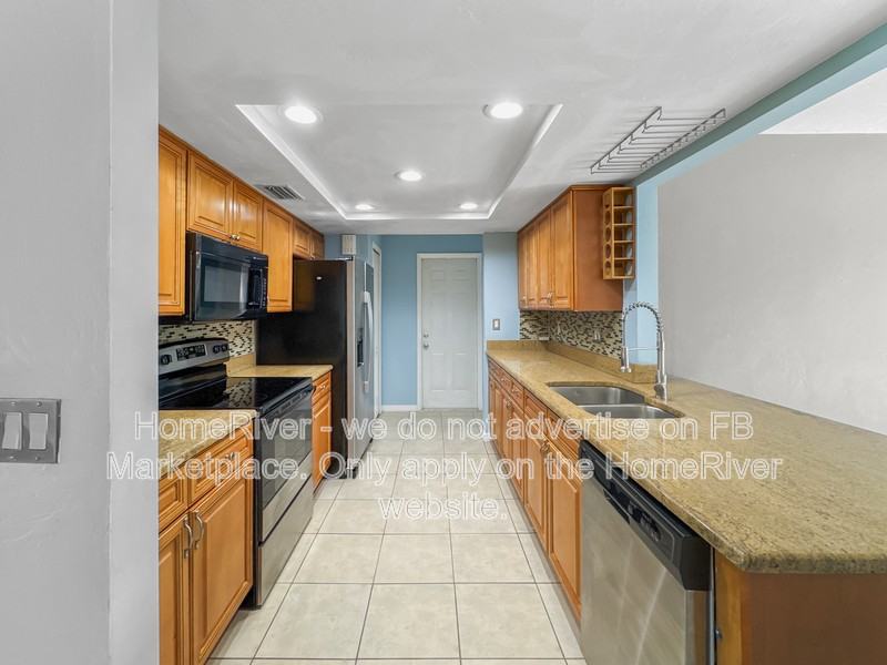 9032 Pomelo Rd W - Photo 2 of 24