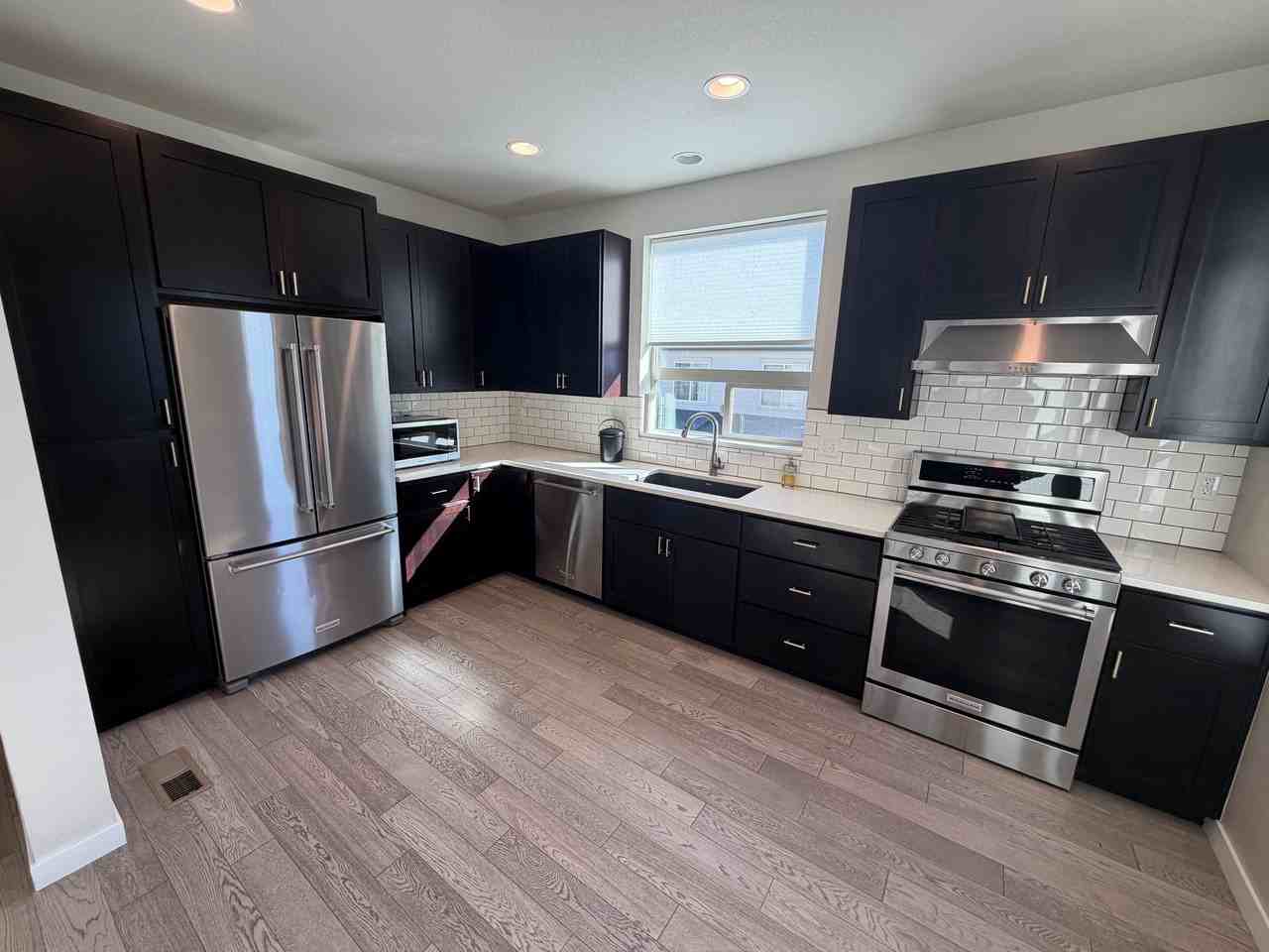 8867 E 55TH AVE - Photo 5 of 15
