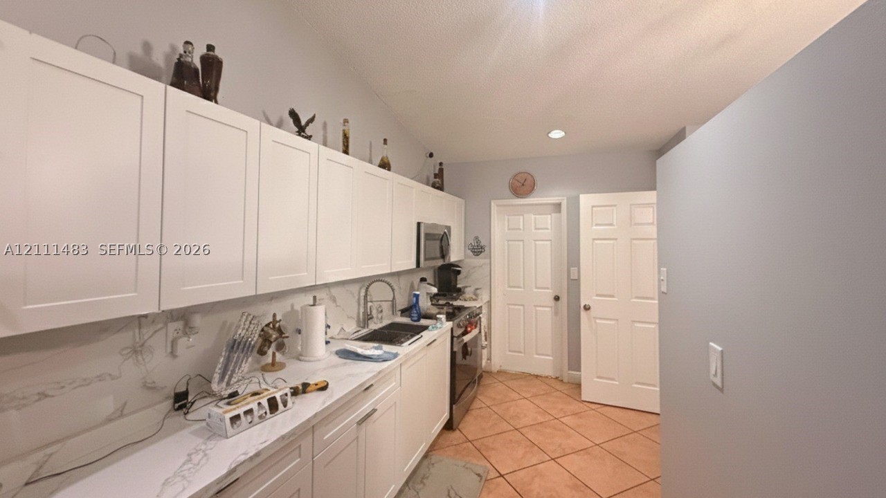 10417 Nw 129th St #MAIN - Photo 6 of 16