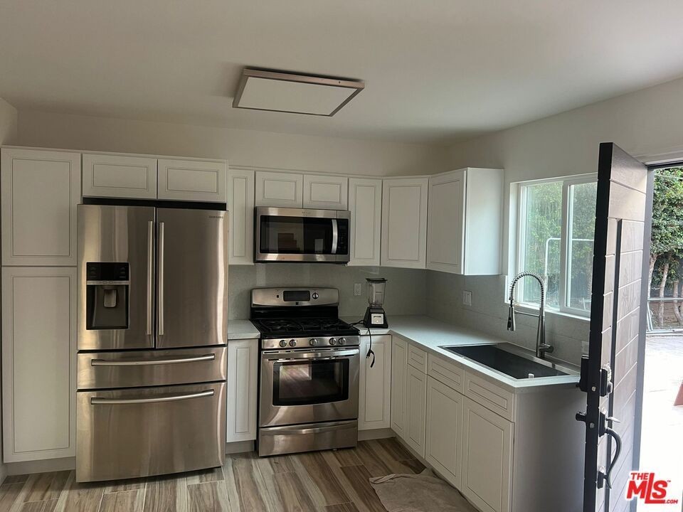 2232 S Spaulding Ave ##2 - Photo 2 of 9
